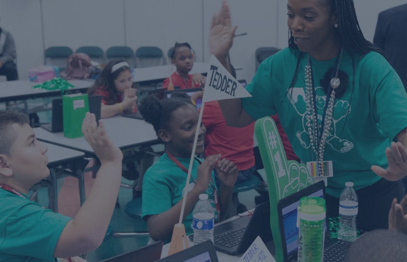 inside a classroom with a teacher and students