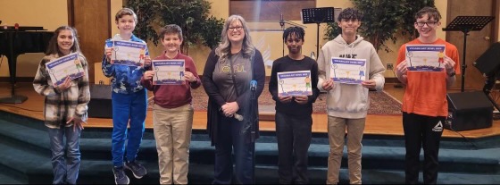 Top learners at Learning Tree Elementary pose with their MVP certificates