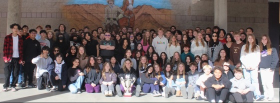 Students pose with their Vocabulary Bowl trophy